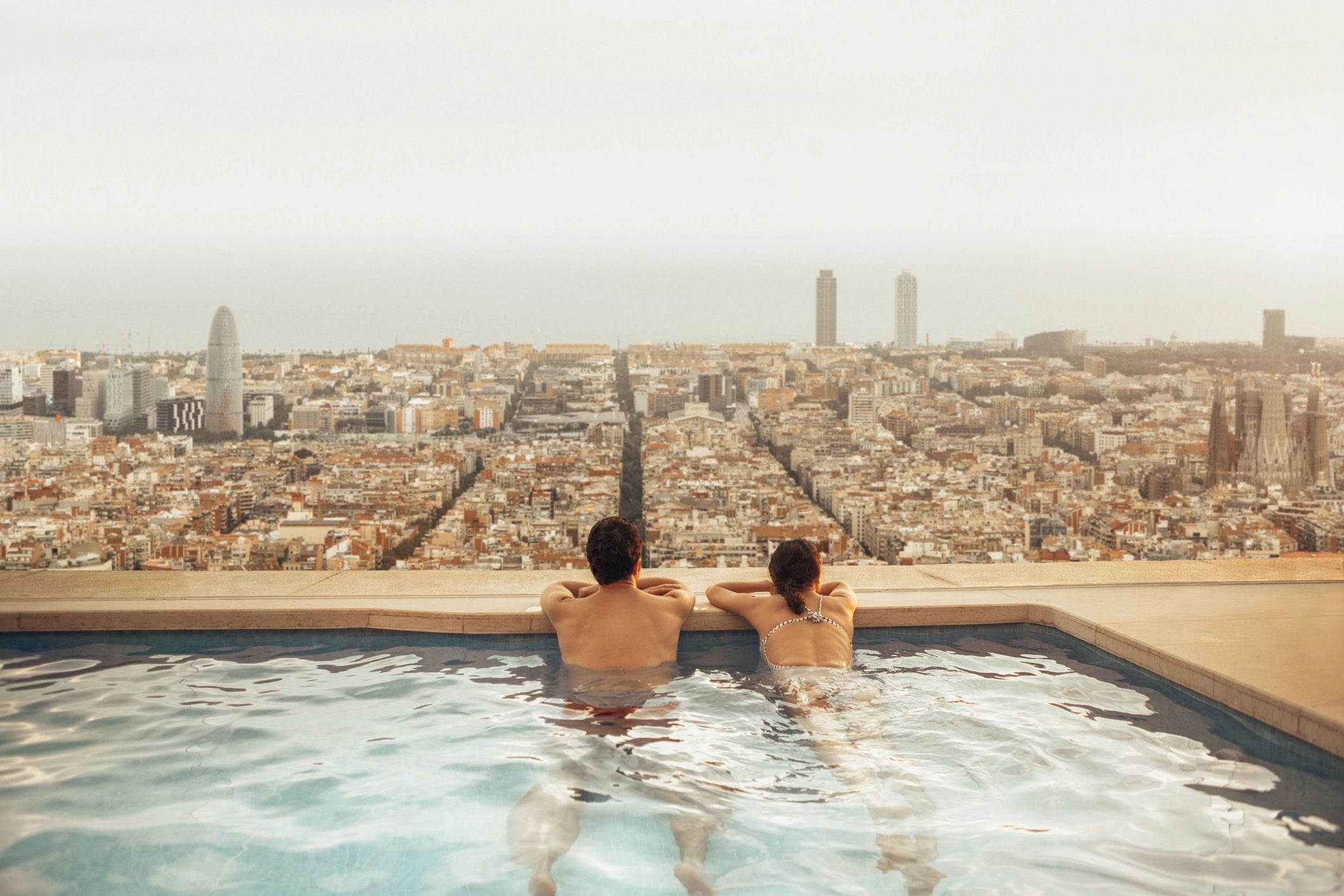 Couple enjoying a premium honeymoon stay with skyline views