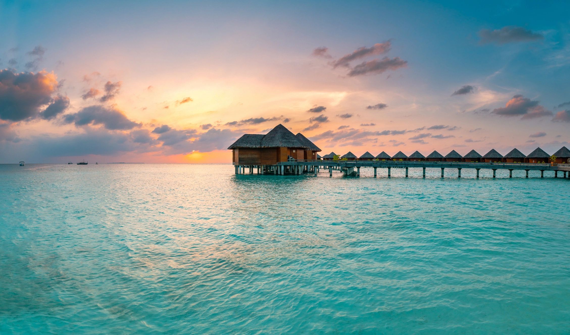 Maldives tropical beach at sunrise for honeymoon travel