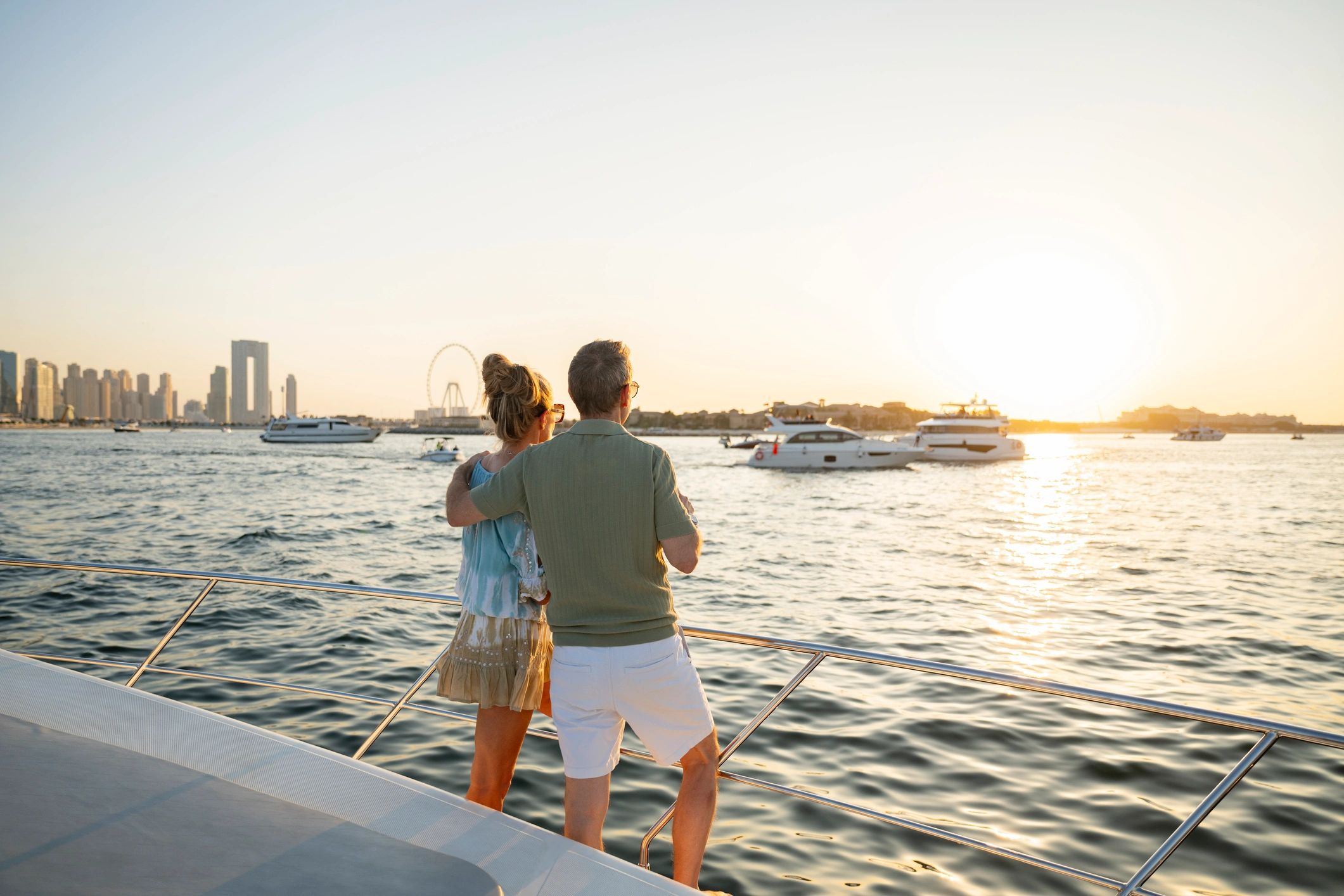 Couple embracing during a luxury sunset travel experience