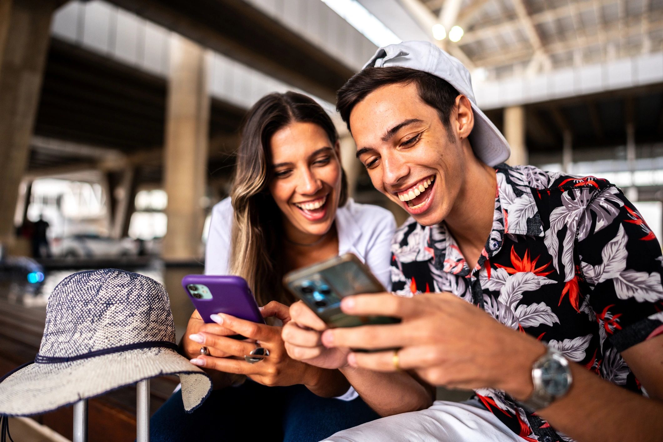Couple planning affordable travel at the airport