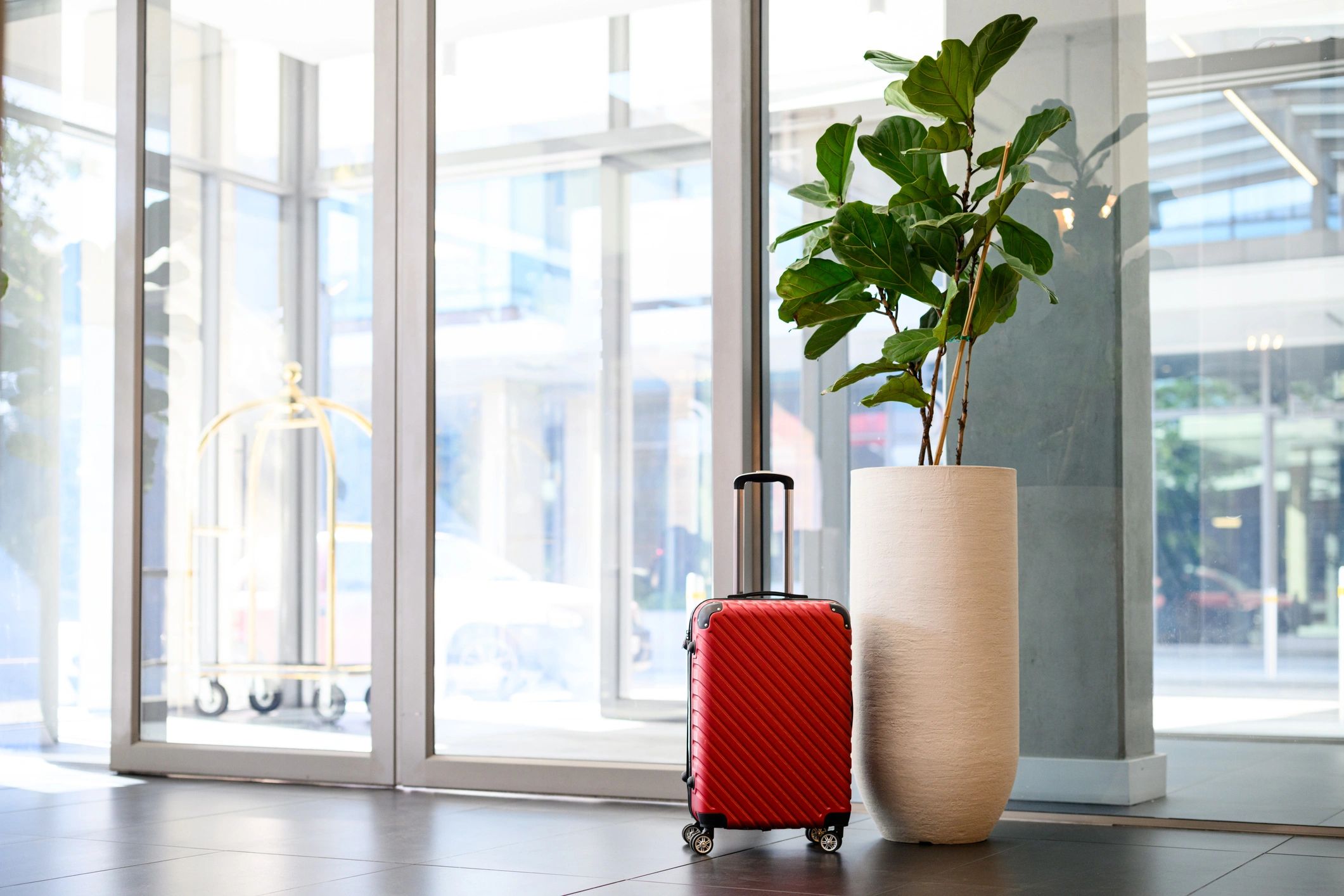 Elegant hotel entrance and luggage symbolizing premium hospitality for Umrah travelers