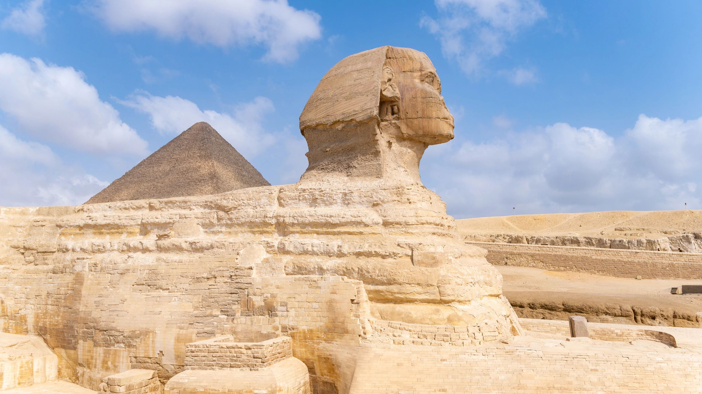 Great Sphinx of Giza with pyramid behind it